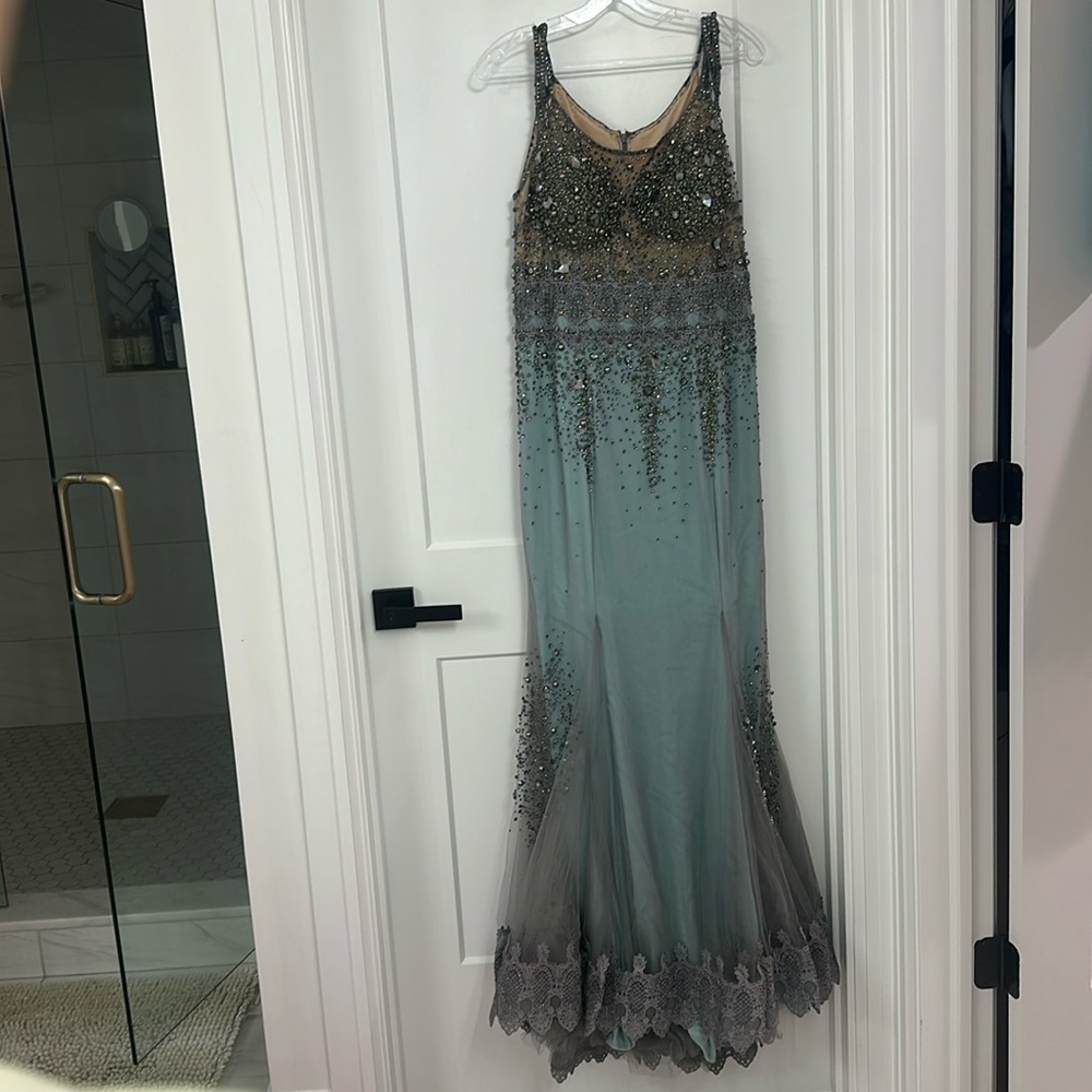 Only worn once. Too part is nude. Beaded heavy evening gown